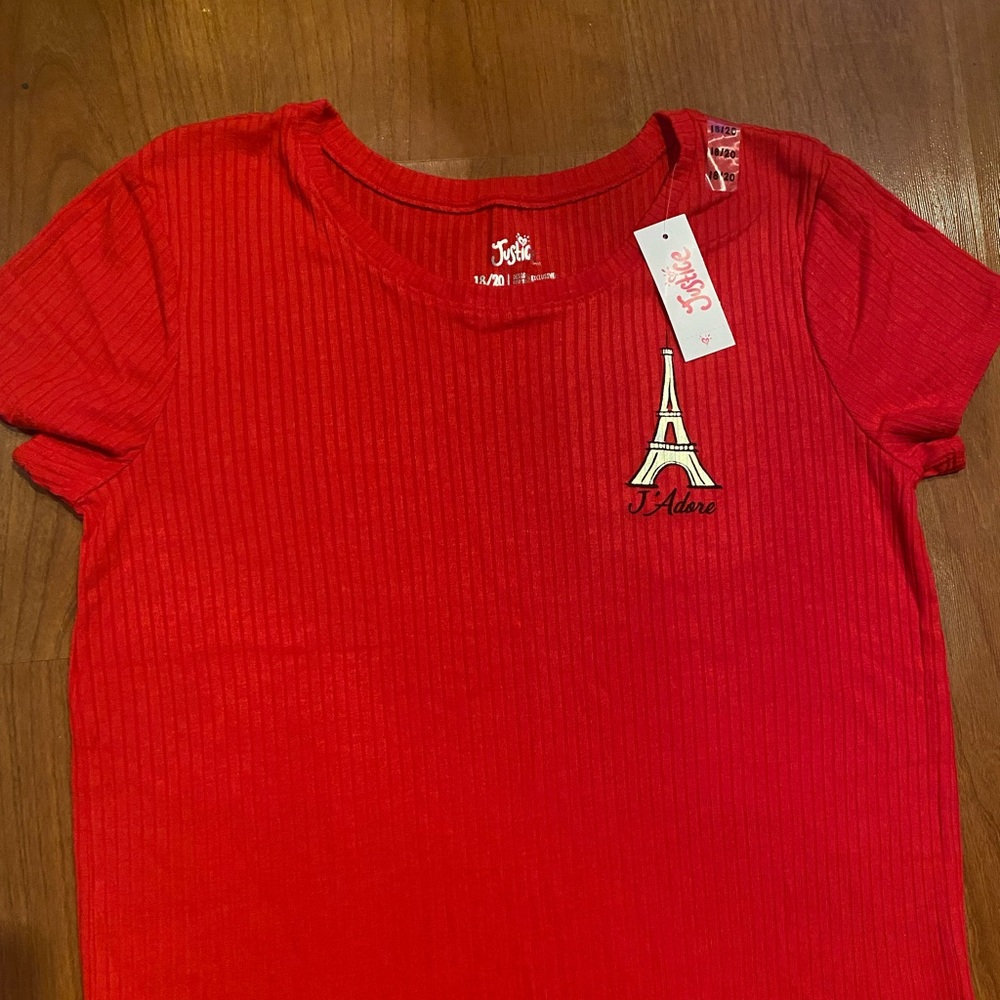 red Justice short sleeved shirt.